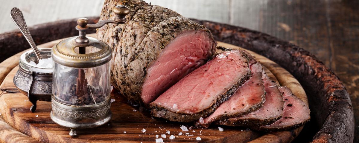 Roast beef joint on a cutting board